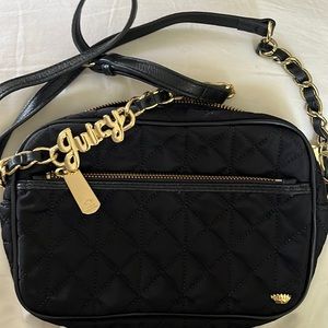 Juicy Couture black purse with gold juicy hardware. 4 pockets total. Lovely!